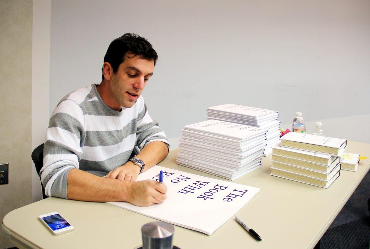 B. J. Novak signs copies of his children's book, 