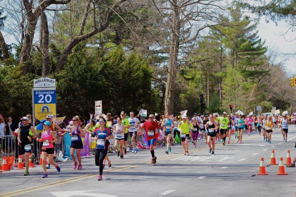 Students volunteer and make signs for Boston Marathon