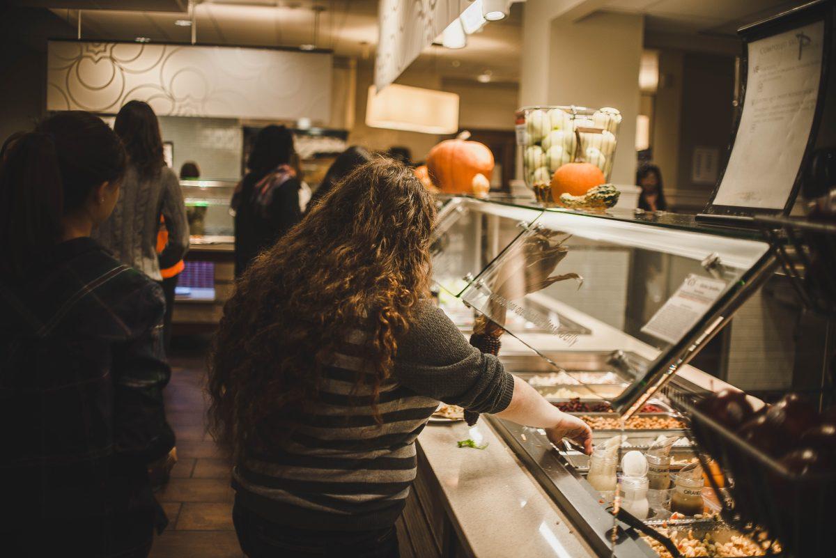 A Wellesley student adding grains to her plate. Photo by Laura Brindley '16, Sports & Wellness Editor