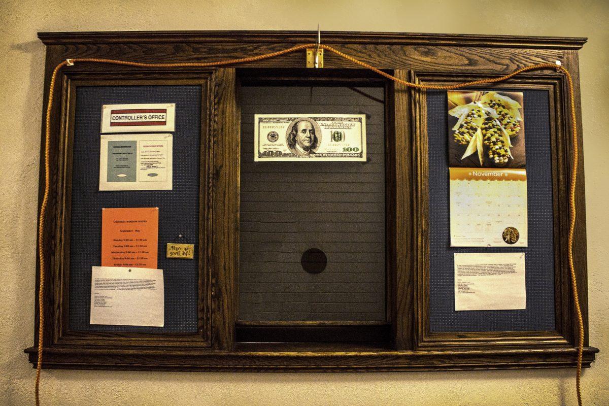 A hundred dollar bill decorates the Controller’s office. Photo by Audrey Stevens '17, Contributing Photographer.