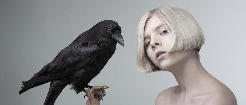 Norwegian singer Aurora poses with a raven in the concept images for her debut album. Photo courtesy of Relevant Magazine