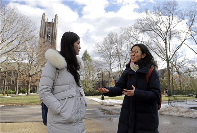 Linda Liu ’19 and Cindy Liu ’18, both students from China, were evaluated using a different process than American applicants to Wellesley. Photo courtesy of Associated Press.