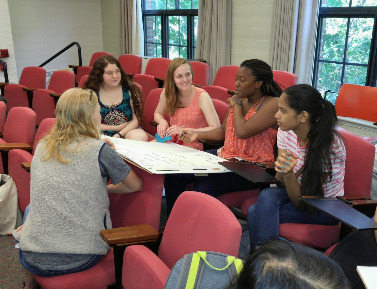 Students discuss ideas for better campus accessibility at a sum- mer brainstorming session. | Courtesy of Eni Mustafaraj