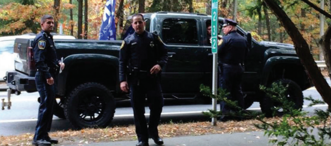 Police escort Babson students off the Wellesley campus. | Photo courtesy of Sydney Robertson. 