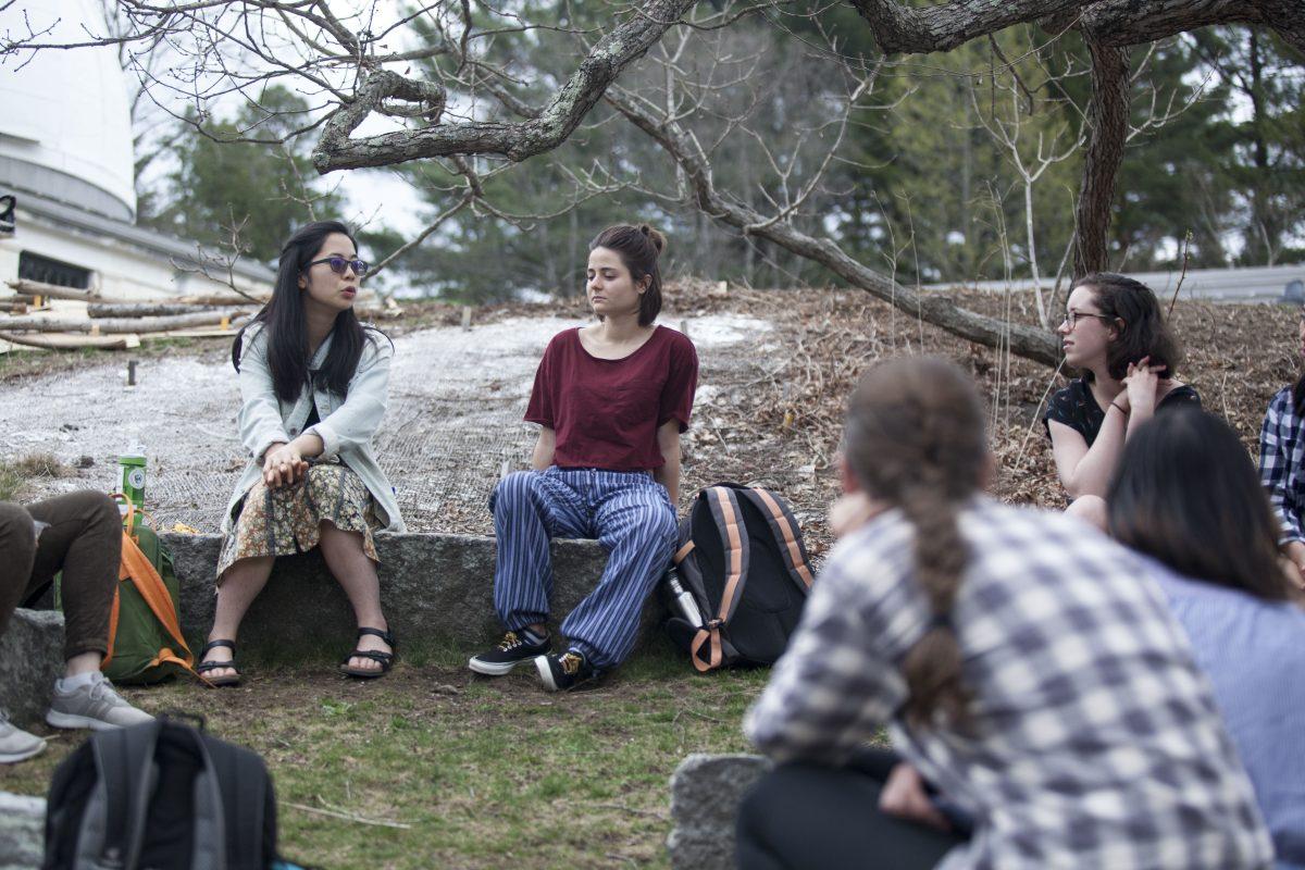 (from left to right) Hazel Leung ’20 and Lara Jones ’18 and other students attend a meeting about sustainability at Wellesley in the edible ecosystem garden. Photo by Audrey Stevens '17. 