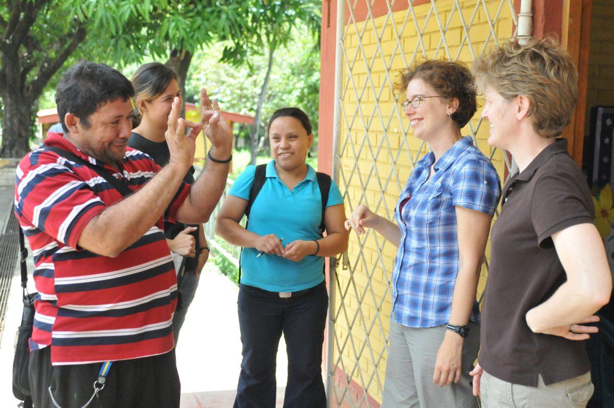 Pyers signs with people in Nicaraguan Sign Language
Photo courtesy of Misha Tulek