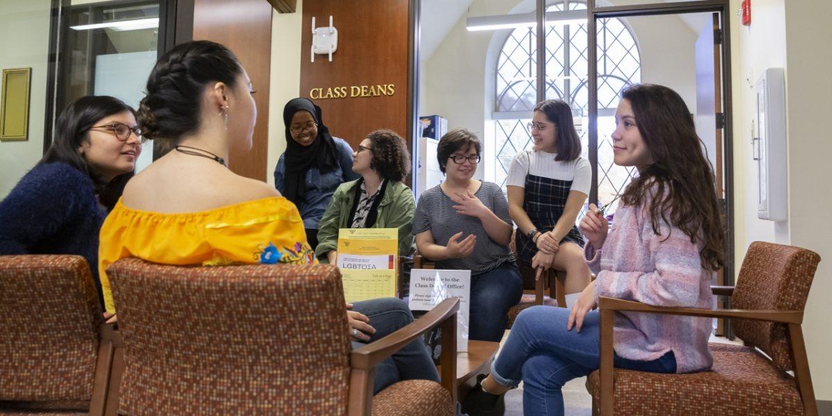 Díaz, far right, meets with other students in Schneider Photo Courtesy of Wellesley College