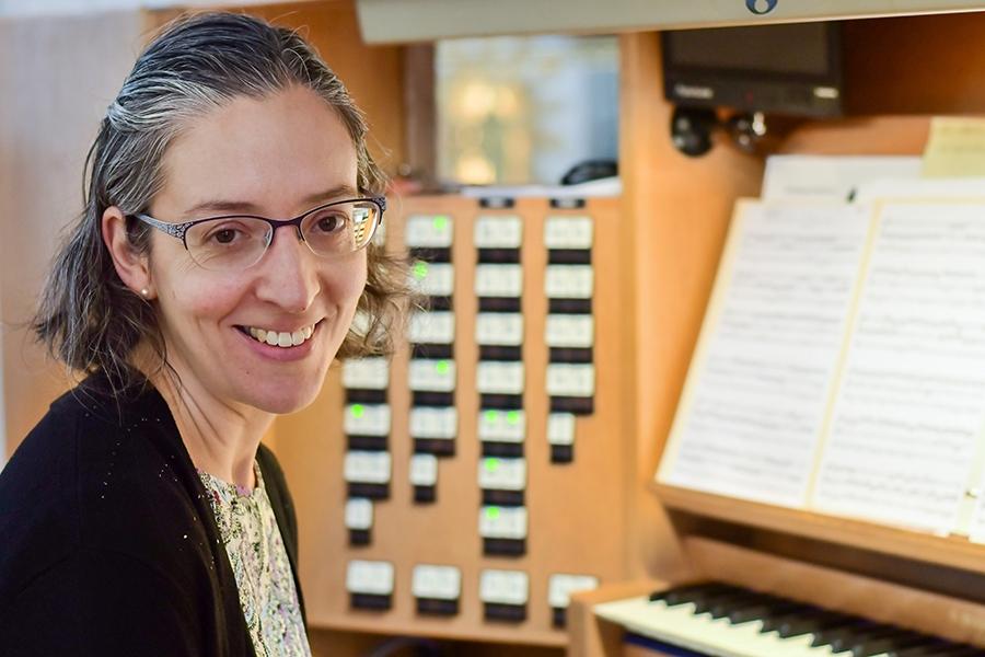 Erica next to an organ