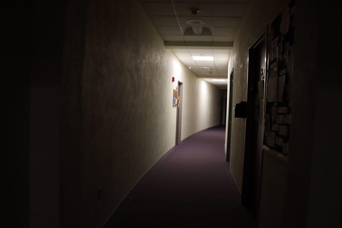 A hallway in Stone-Davis Hall is dimly lit by emergency lights during the power outage. Photo courtesy of Serena Chan.