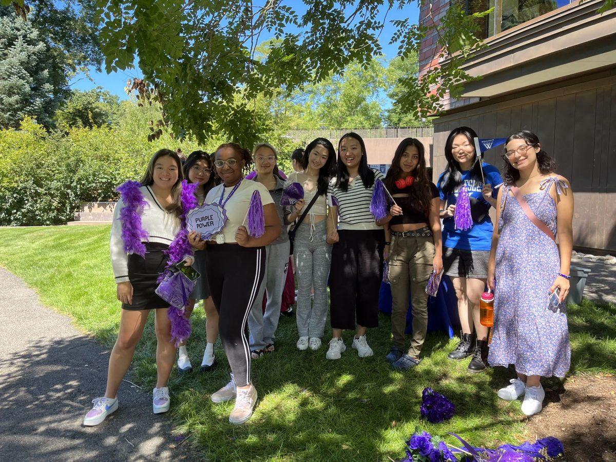 Members of the Wellesley Class of 2026 pose with class merch outside of Lulu