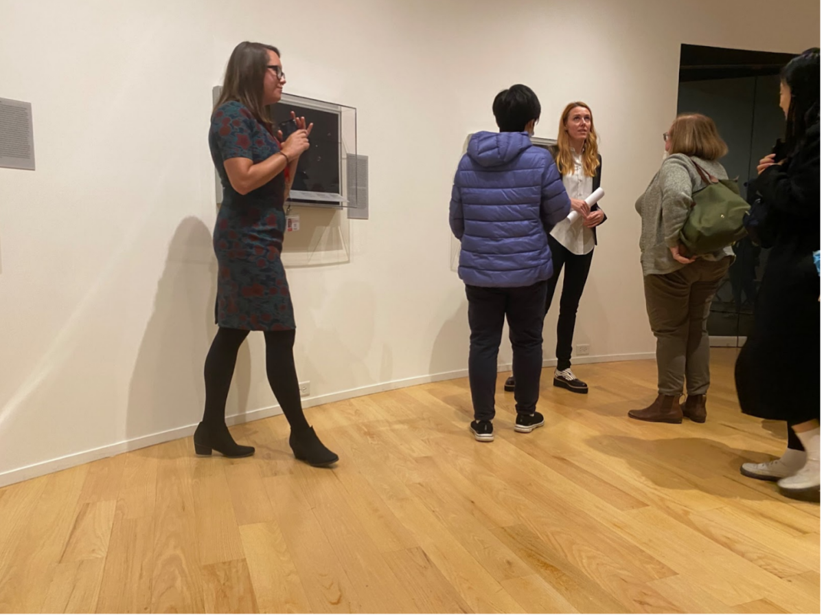 Attendees of the Davis event get a closer look at the exhibit. Photo courtesy of Kamila Lim.