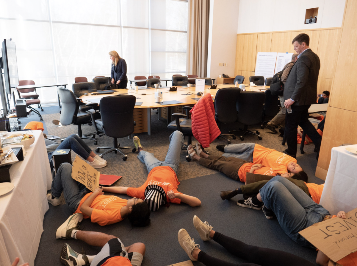 Student group, Divest Olin, interrupts Board of Trustees meeting. 

Photo Courtesy of Brooke Moss