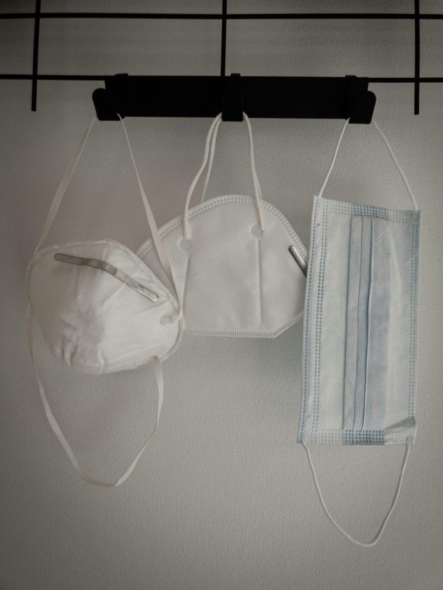 Photo of three masks hanging on a hook