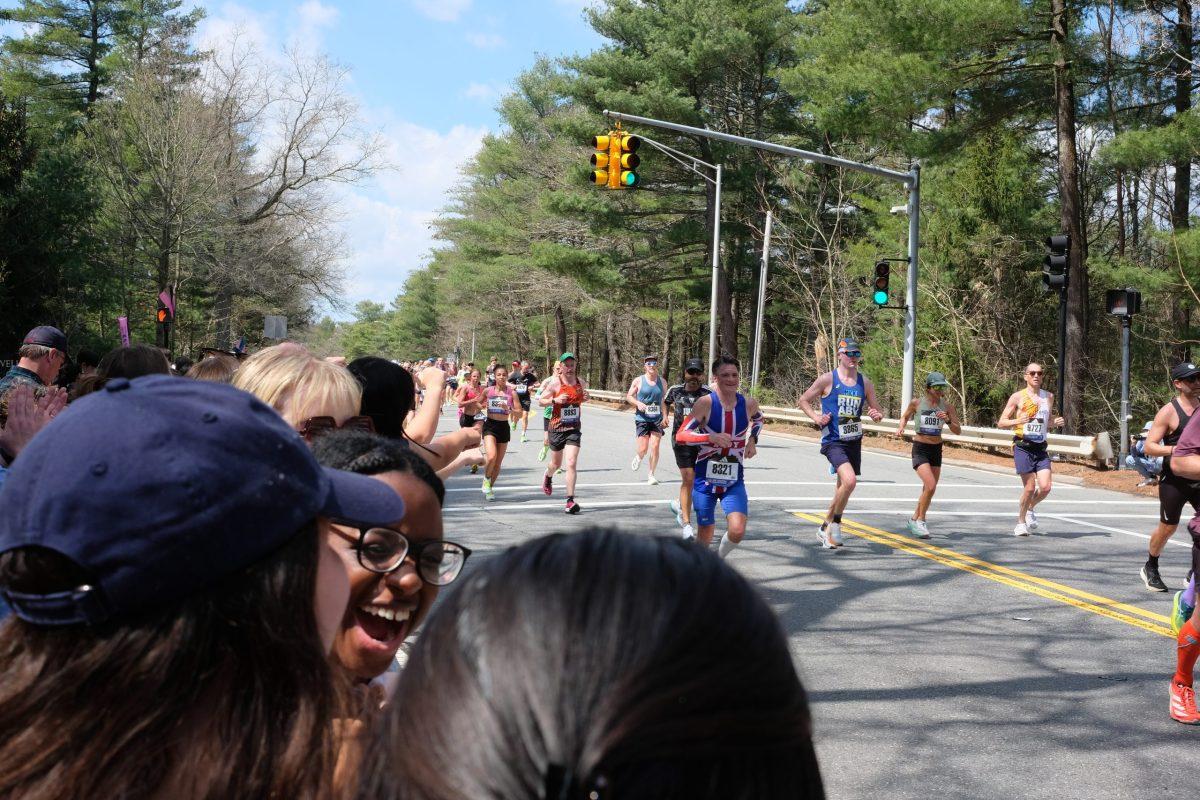 Boston Marathon runnings running through the Wellesley college scream tunnel in 2024