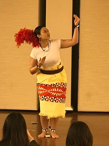 Uesili Kuli performs the tau’olunga. 
Photo Courtesy of India Lacey. 