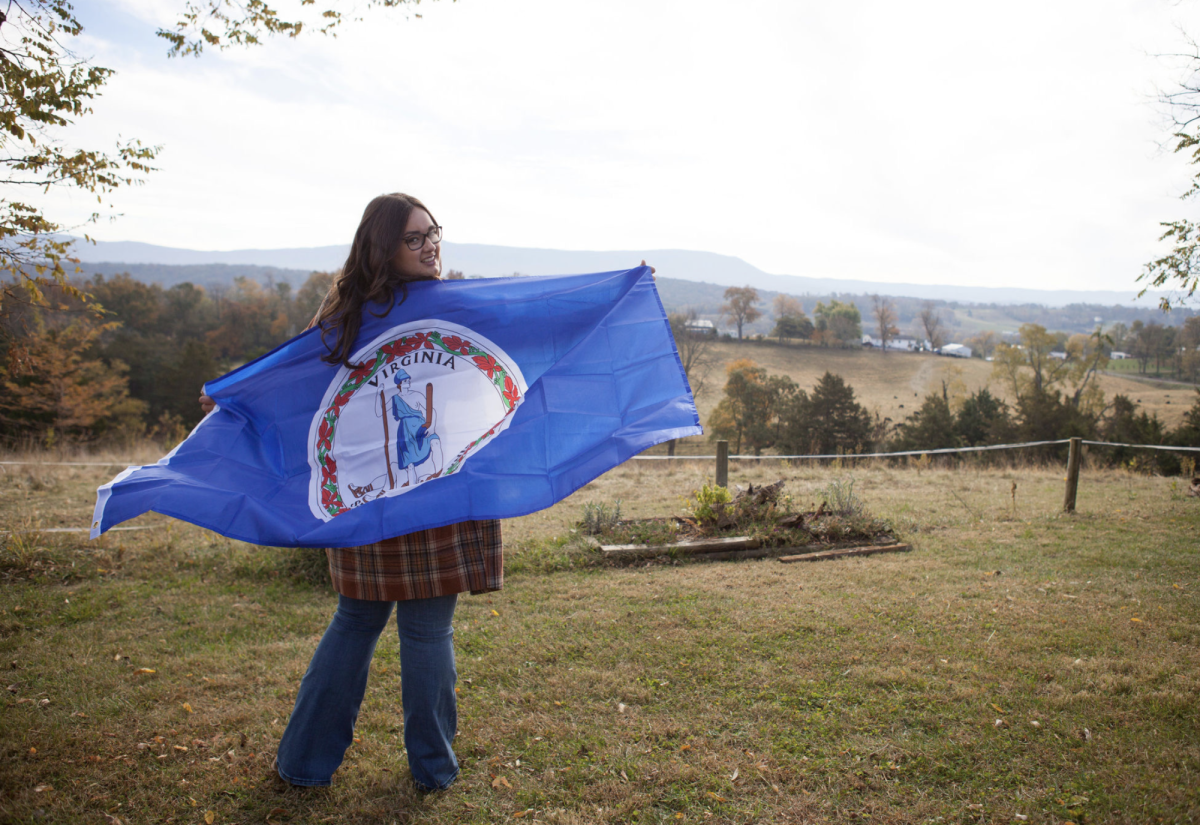 Abby Garber with the Virginia flag. Photo courtesy of Abby Garber. 