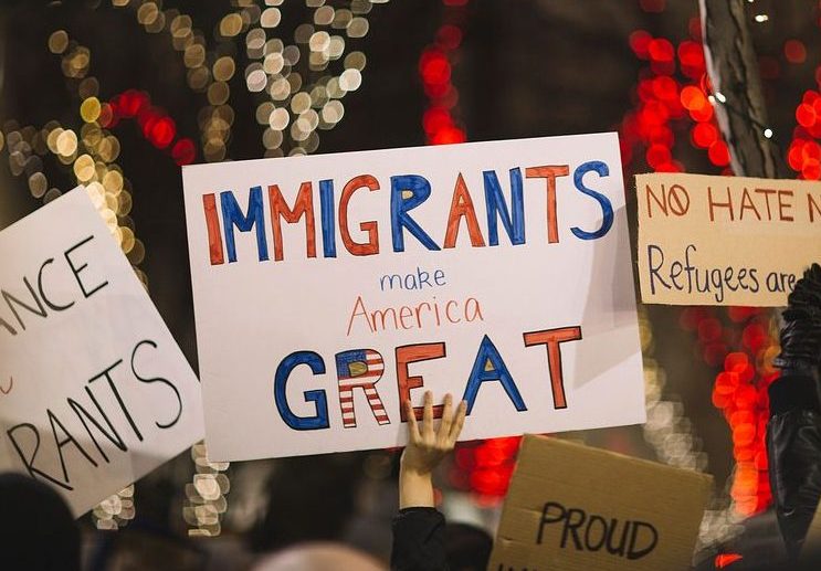 Signs at an anti-ICE protest. Image courtesy of Wikimedia Commons.